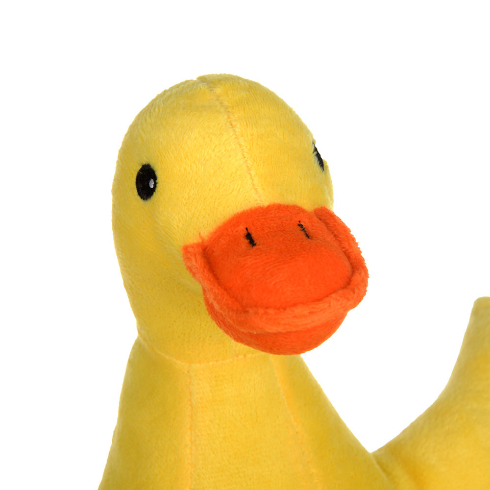 Yellow plush duck dog toy, side view