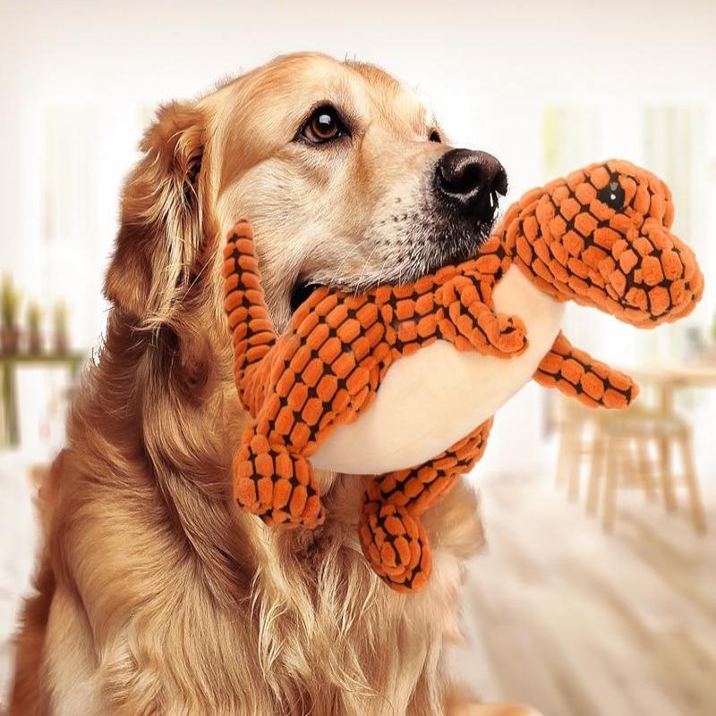 Green squeaky dinosaur dog toy showing soft plush body