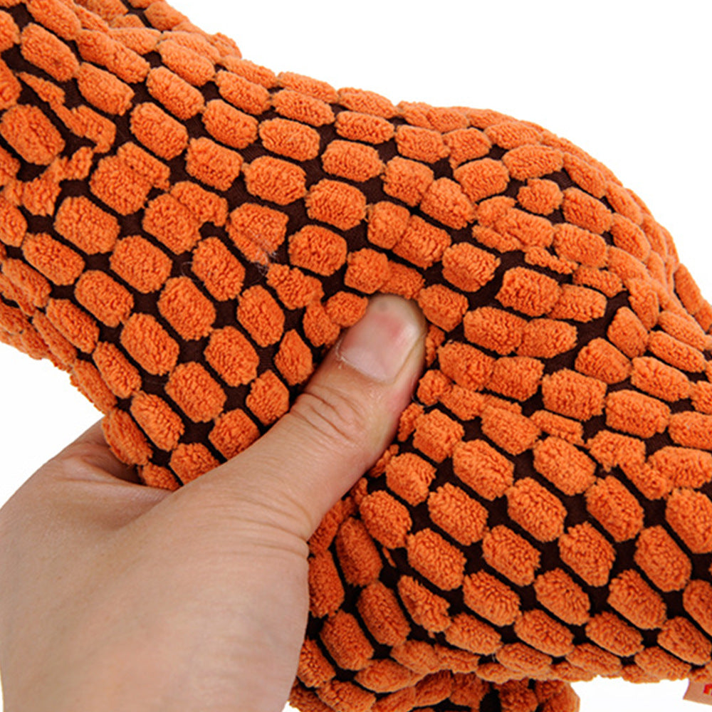 Light brown plush squeaky T-Rex dog toy standing