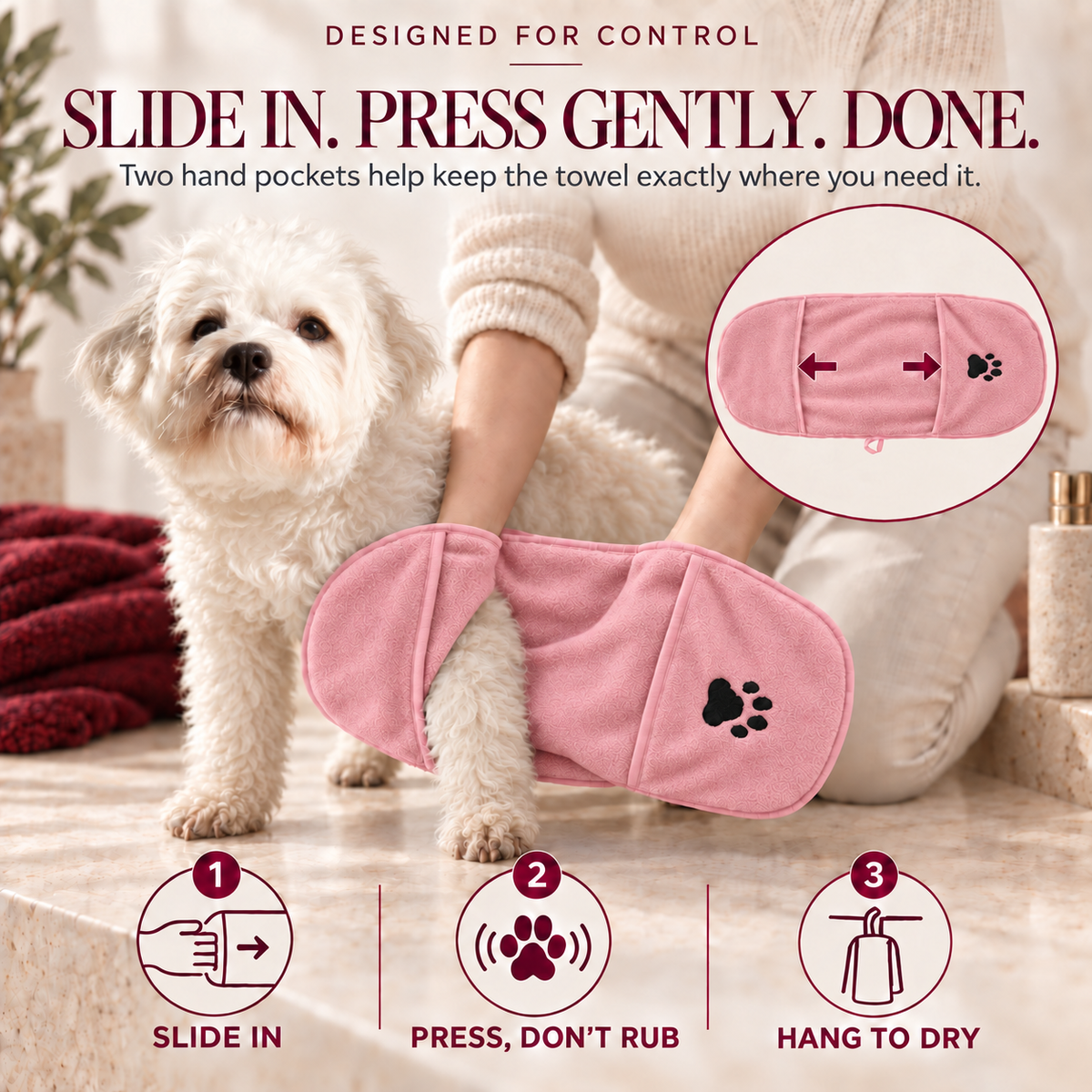 Person using a pink hand-pocket towel to gently dry a dog’s front leg