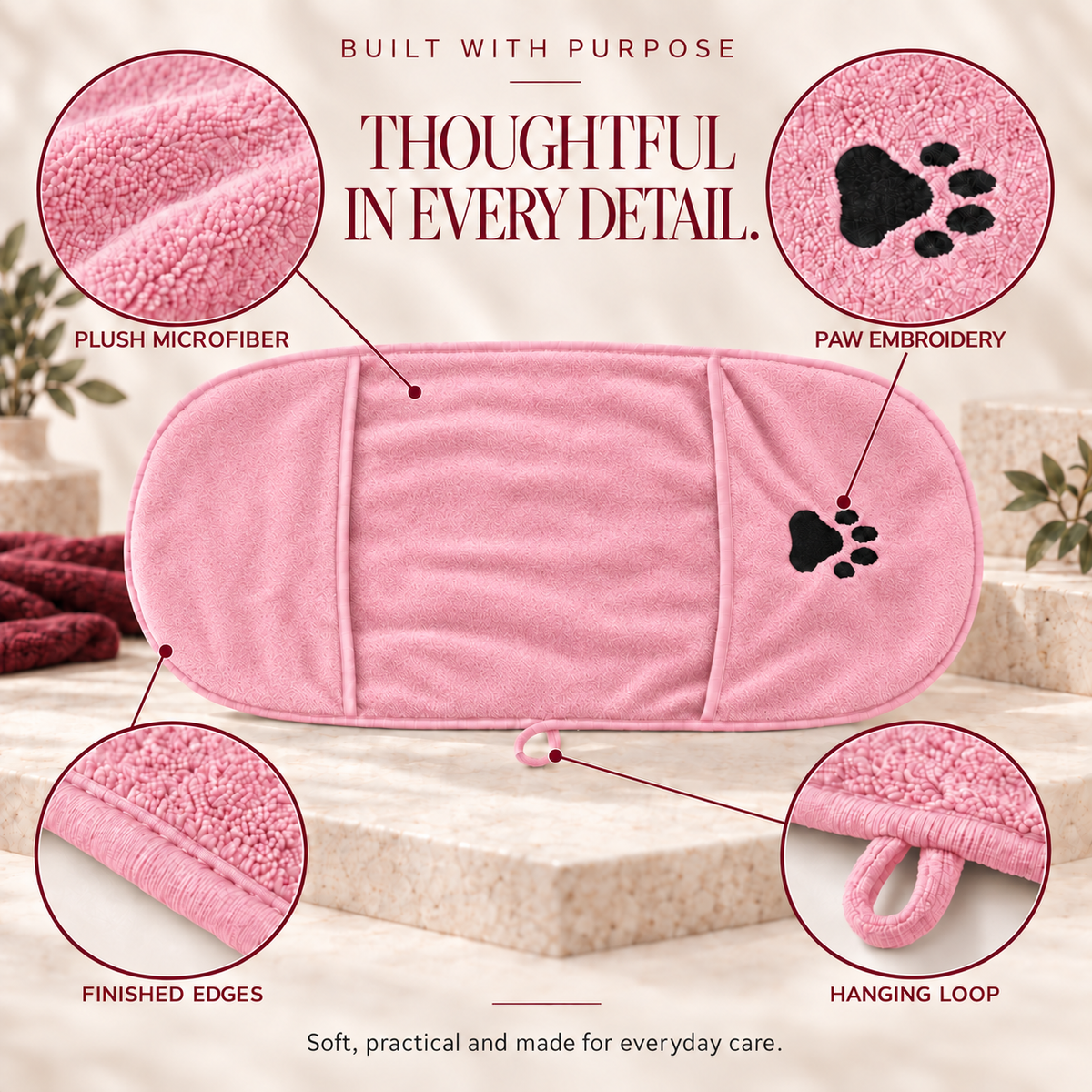 Pink microfiber dog towel with finished edges, hand pockets and hanging loop